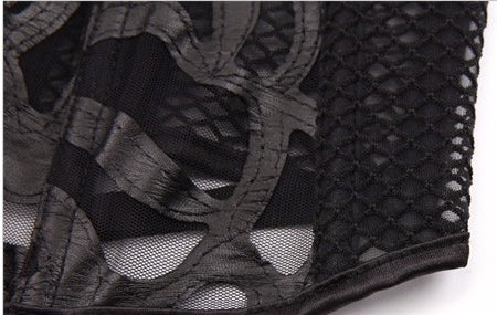 Close-up of lace and mesh corset featuring intricate patterns and elegant design