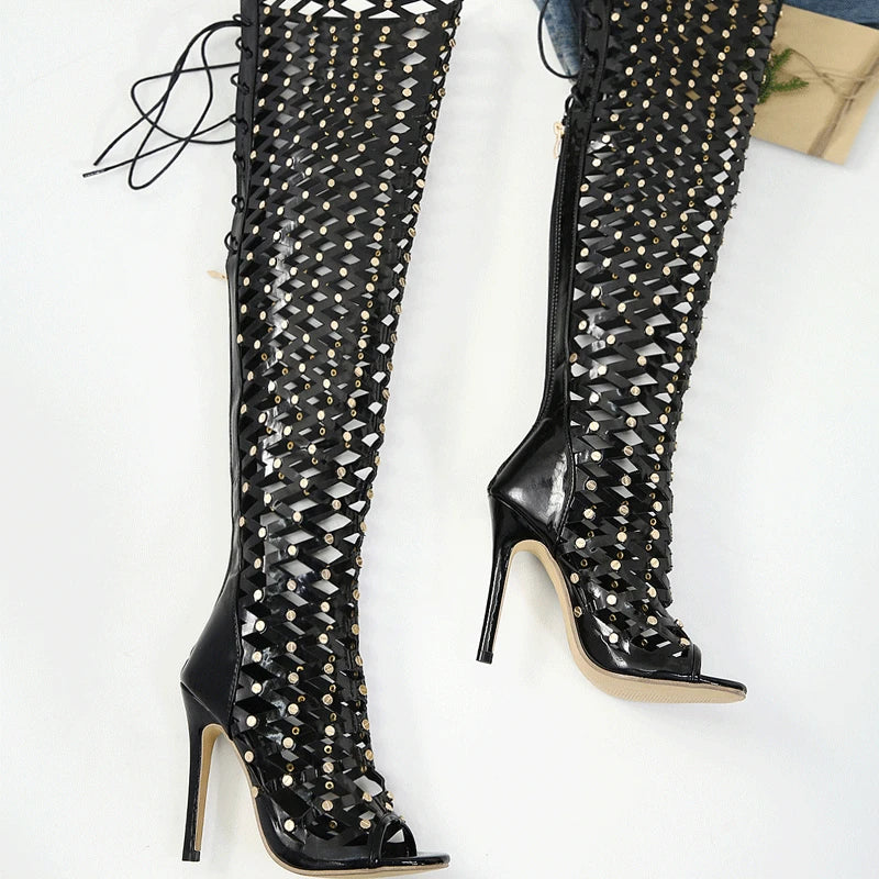 Stylish black gladiator over the knee boots with high heels and lace-up design