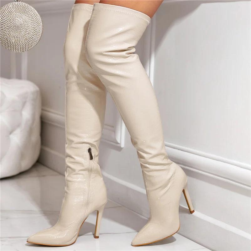 Glossy over the knee boots in beige with pointed toe and stiletto heel for a chic look