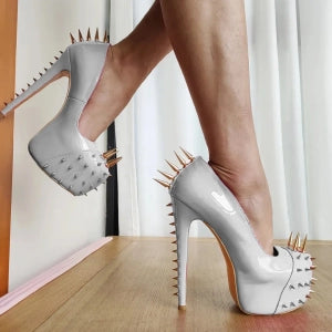 Stylish gold riveted platform pumps with spike details for a bold fashion statement