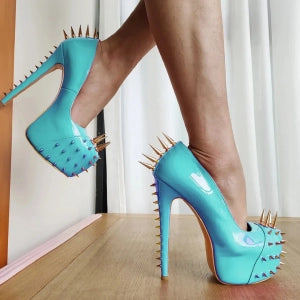 Stylish gold riveted platform pumps with a blue finish and spike detailing on the back