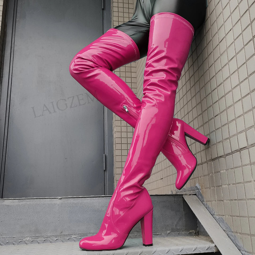 Pink shiny thigh high boots with high heels, perfect for a bold fashion statement