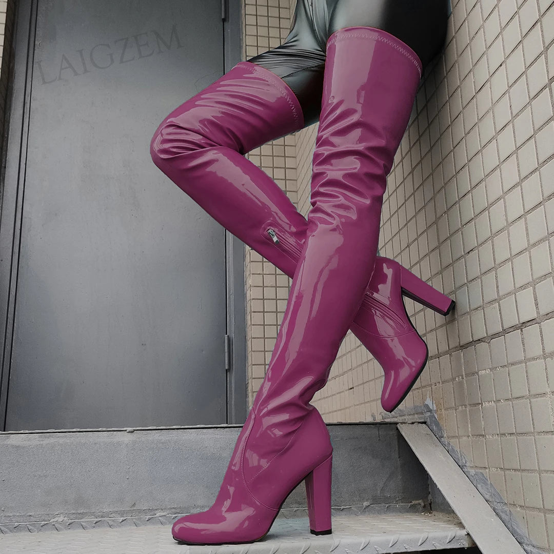 Shiny thigh high boots in vibrant purple with a stylish heel for a chic look