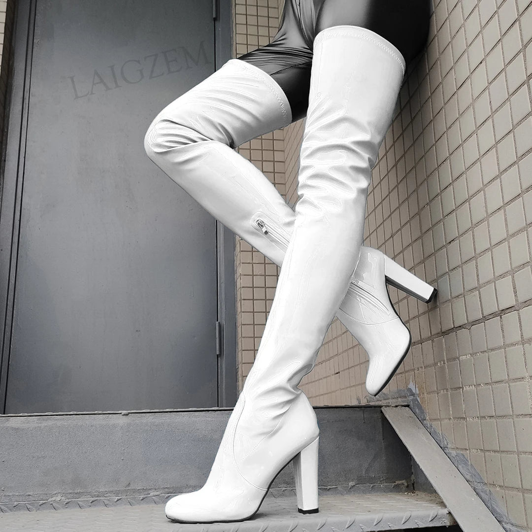 Stylish shiny thigh high boots in white with high heels for a bold fashion statement