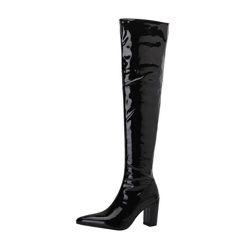 Shiny black over the knee leather boots with a pointed toe and block heel for a stylish look