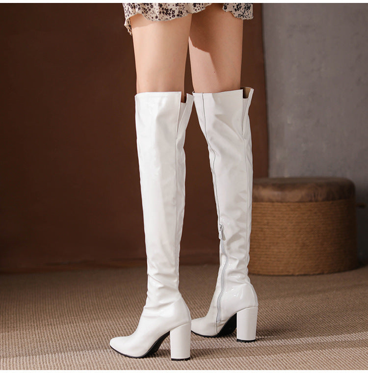 Stylish over the knee leather boots in white with a sleek design and high block heels