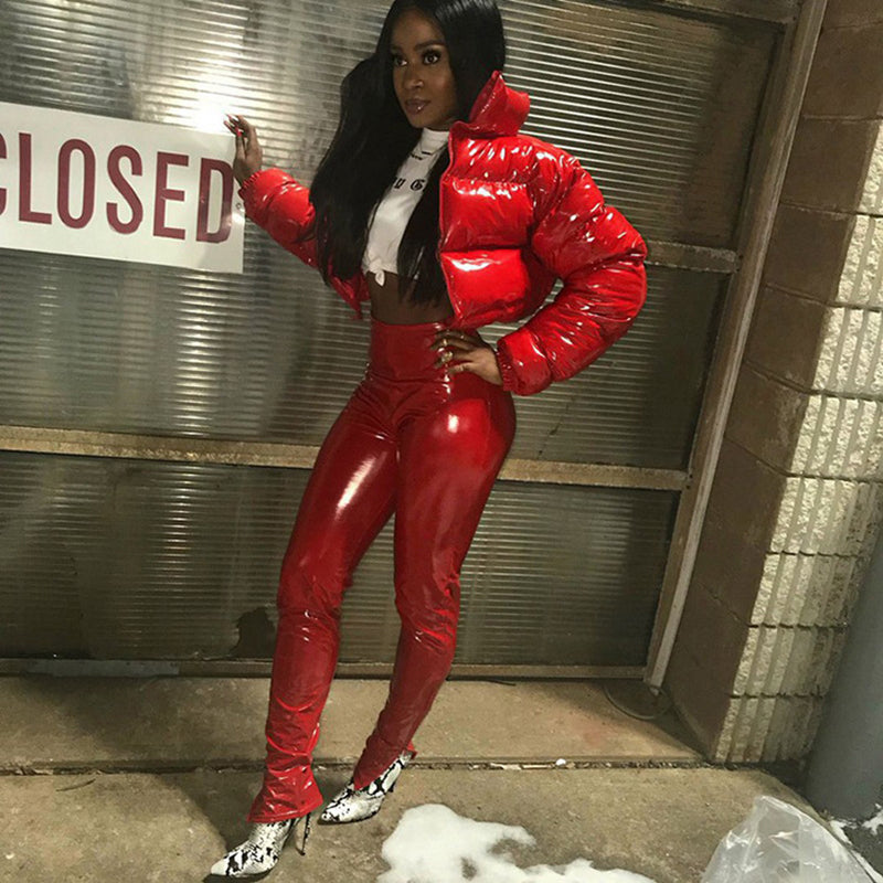 Trendy cropped shiny puffer coat in red, paired with matching glossy red pants for a stylish look