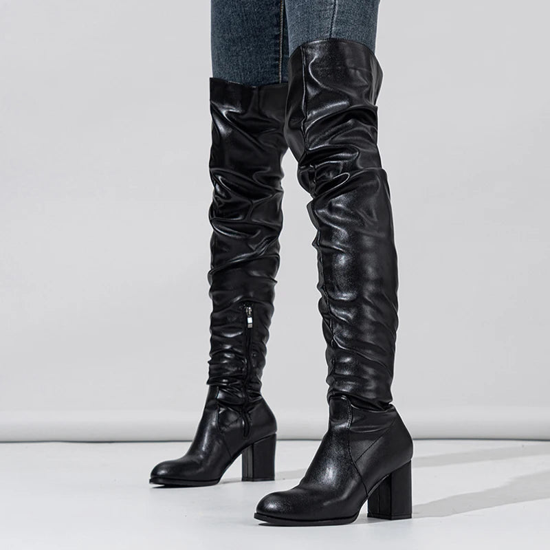 Soft pleated leather knee boots with a sleek design and chunky heels, perfect for stylish outfits