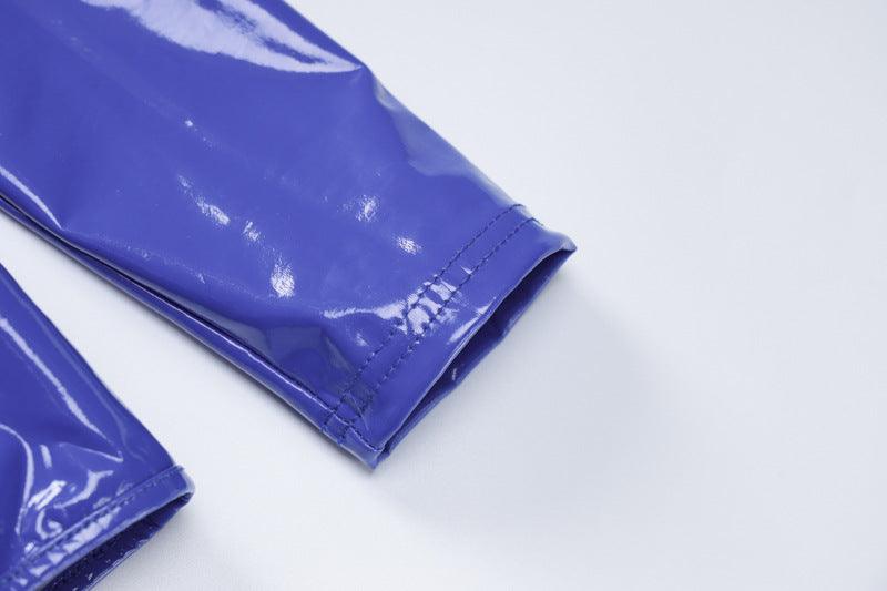 Detail view of blue faux leather cutout dress showcasing the glossy sleeve finish