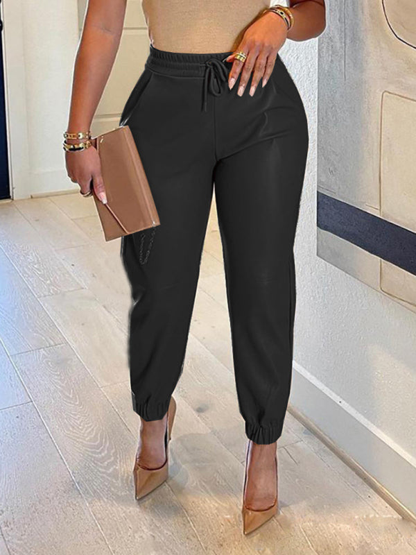 Kakaclo drawstring faux leather trousers in black with elastic cuffs for a stylish look