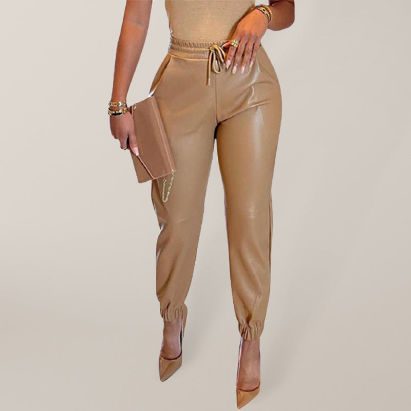 Kakaclo drawstring faux leather trousers in tan with tapered ankles and stylish design