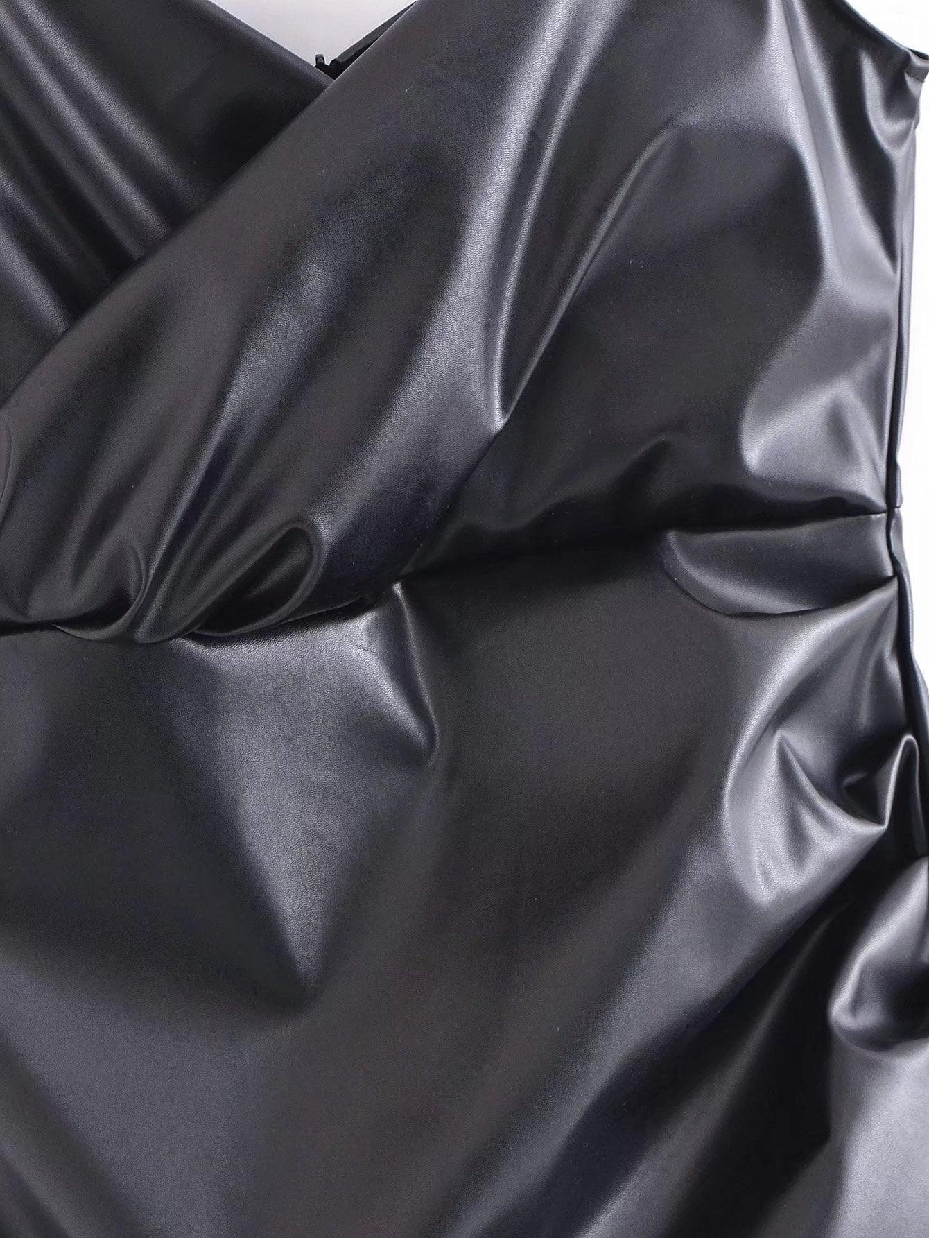 Close-up of a sleek black faux leather evening dress showcasing its smooth texture and elegant design