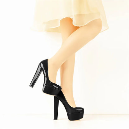 Black patent leather platform heels with a sleek design and tall heels from Your Shiny Clothes