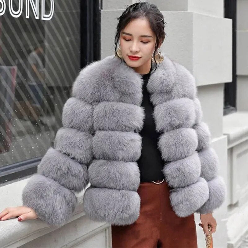 Stylish luxury faux fur coat in grey with plush texture and elegant design for chic winter outfits