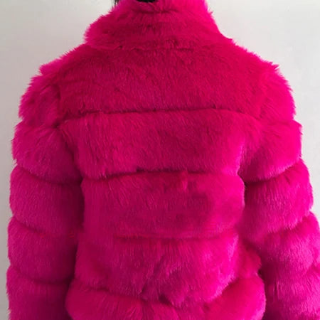 Bright pink luxury faux fur coat with a plush texture for a stylish, fashion-forward look