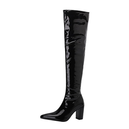 Shiny black over the knee leather boots with a pointed toe and block heel for a stylish look