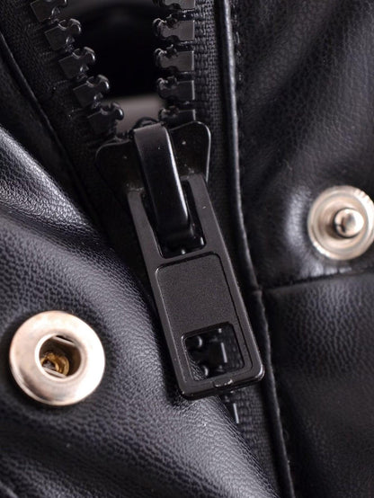 Close-up of black zipper and snap buttons on faux leather body warmer by TRAF