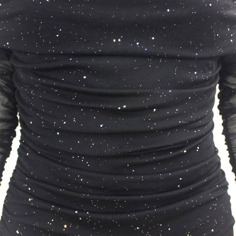 Black off-shoulder evening dress with a ruched design and starry pattern