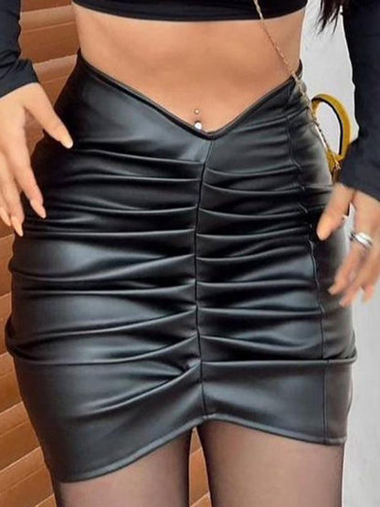 Kakaclo vegan leather ruched skirt featuring stylish detailing and a flattering fit
