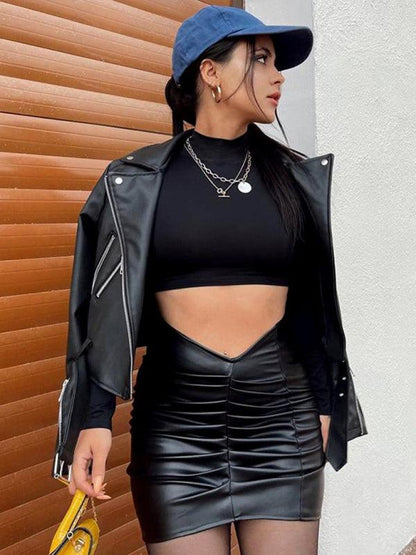 Kakaclo vegan leather ruched skirt styled with a black top and leather jacket for a chic look
