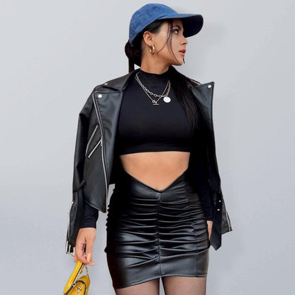Kakaclo vegan leather ruched skirt styled with a black crop top and leather jacket